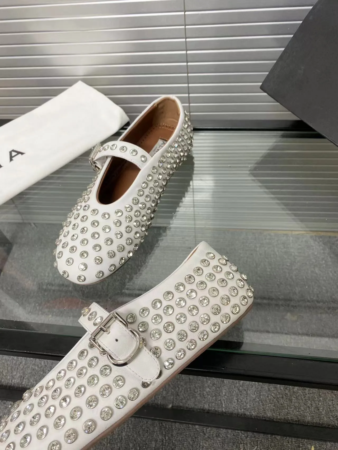 Alaia Cowhide Sheepskin Glossy Round-Toe Buckle Studded Mary Jane Flats in White · view 6