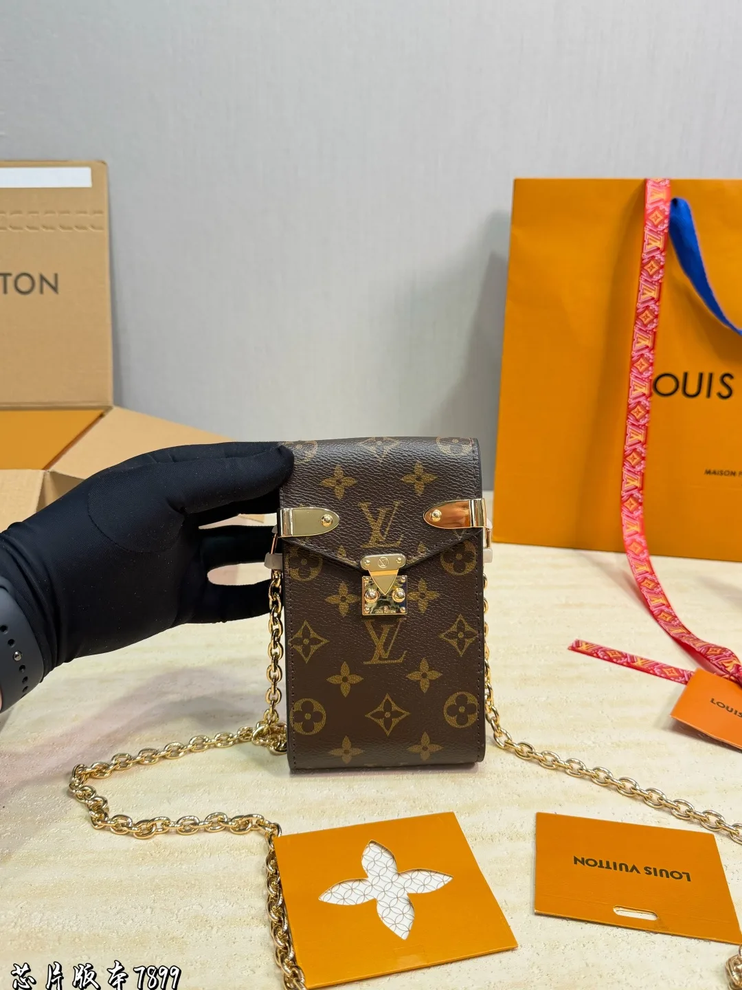 Louis Vuitton Phone Shoulder Pouch in Brown · view 1