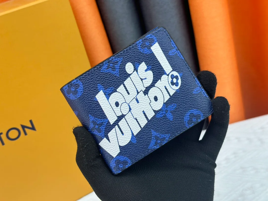 Louis Vuitton Canvas Monogram Wallet in Blue · view 1