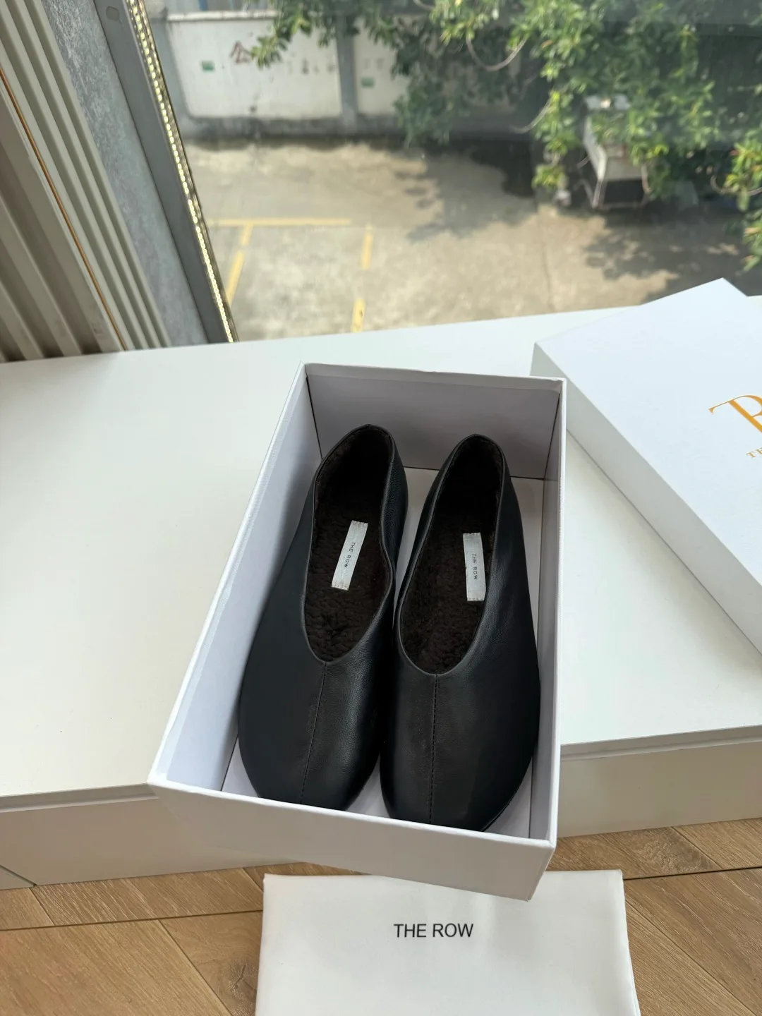 The Row Cowhide Smooth Round-Toe Ballet Flats in Black · view 7