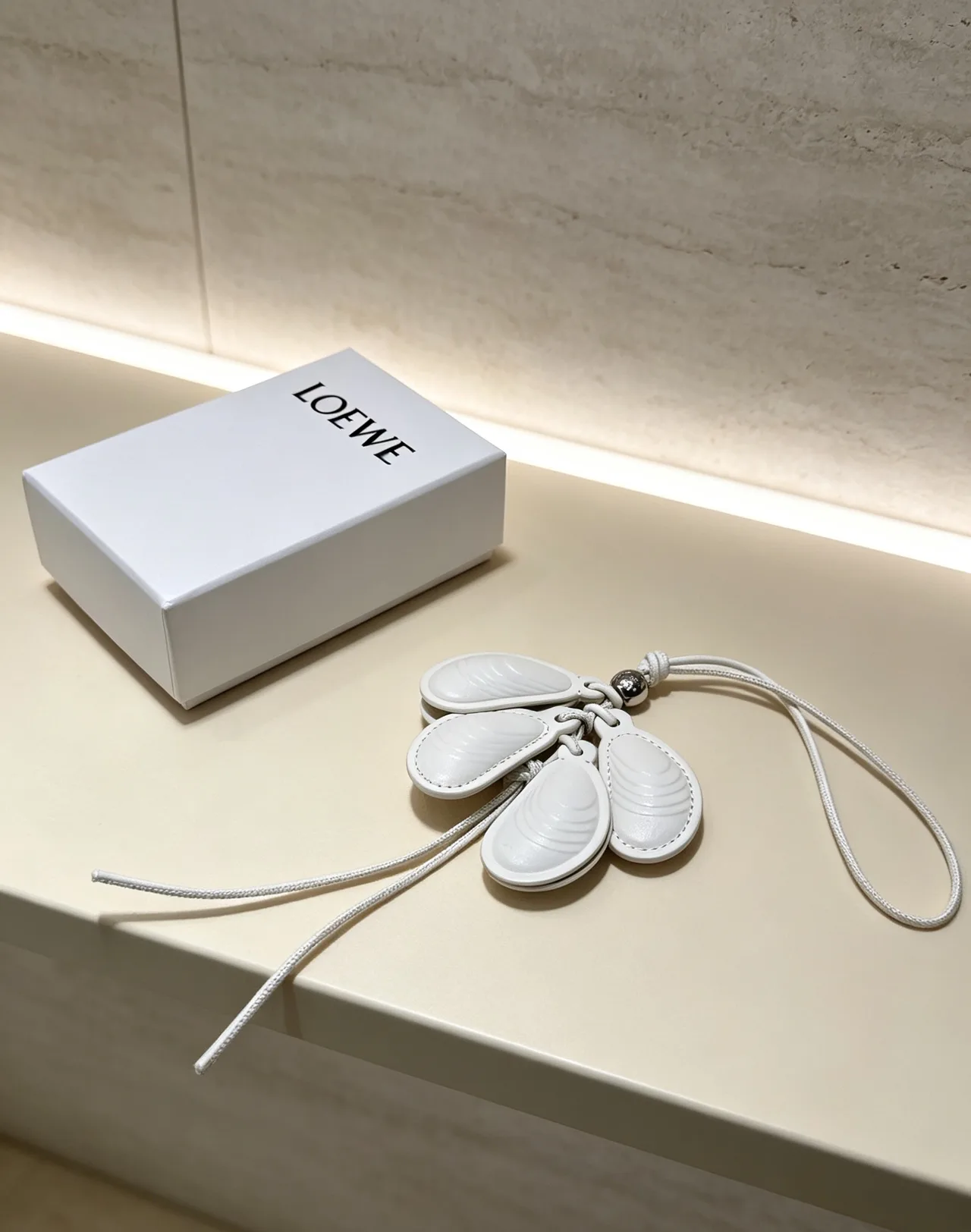 Loewe Leather Shell Bag Charm in White · view 1