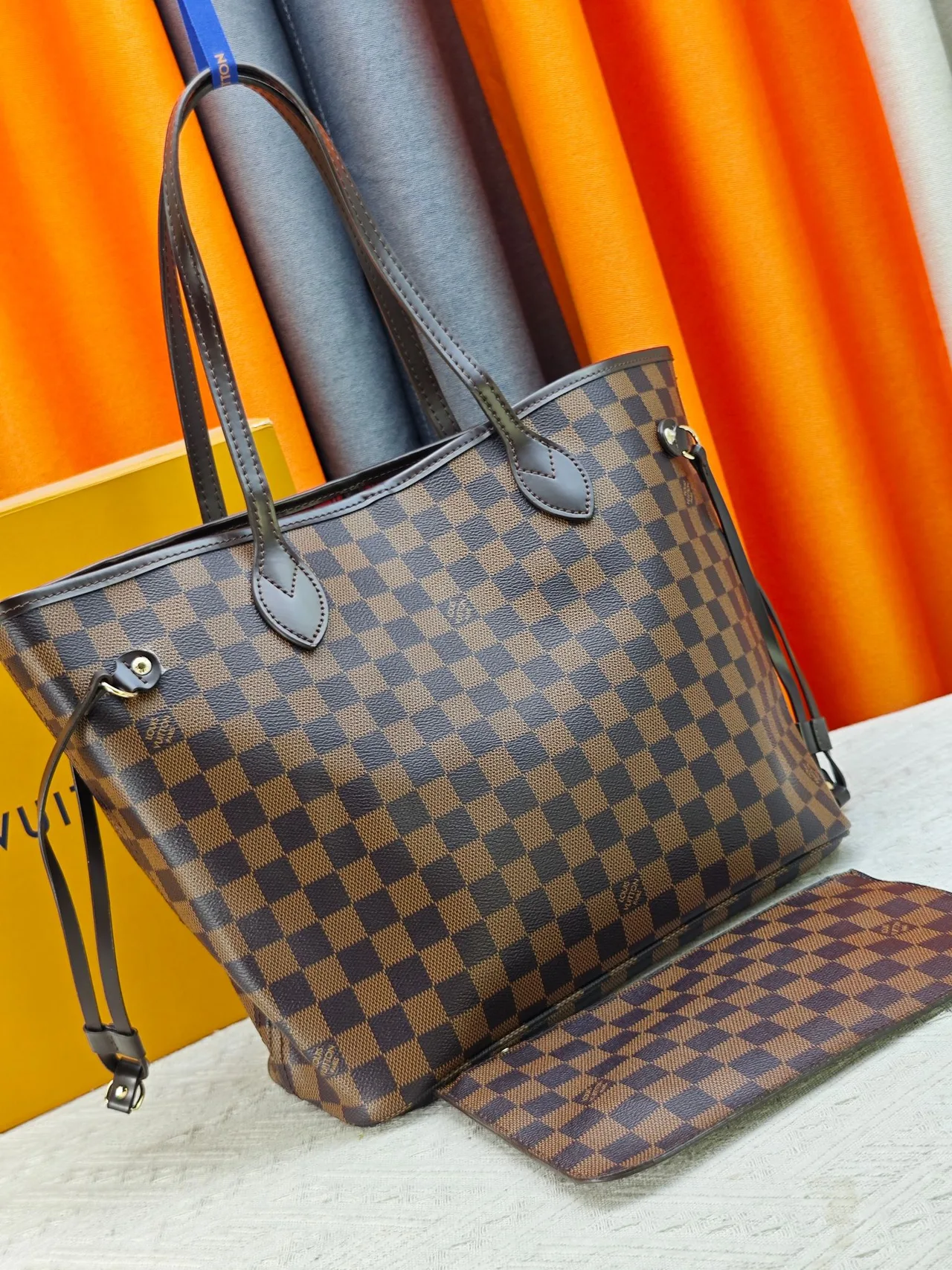Louis Vuitton Neverfull Clutch in Brown · view 2