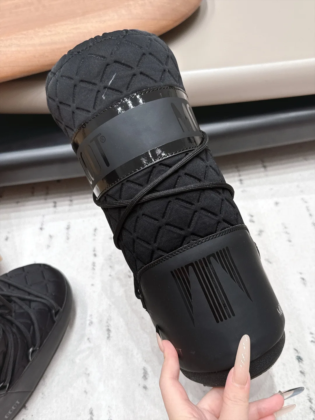 Moon Boot Glossy Quilted Snow Boots in Black · view 7