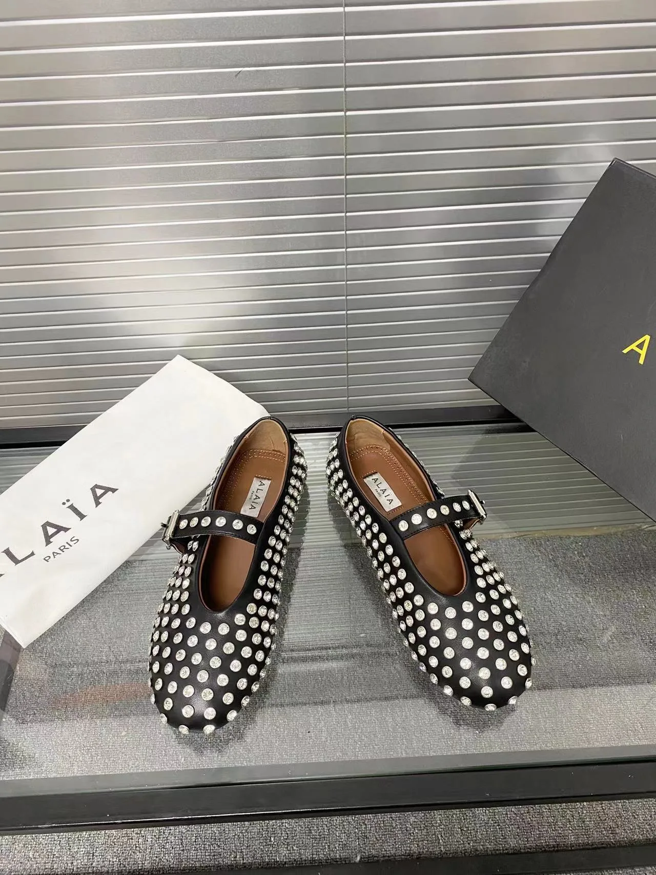 Alaia Cowhide Sheepskin Buckle Studded Mary Jane Flats in Black · view 4