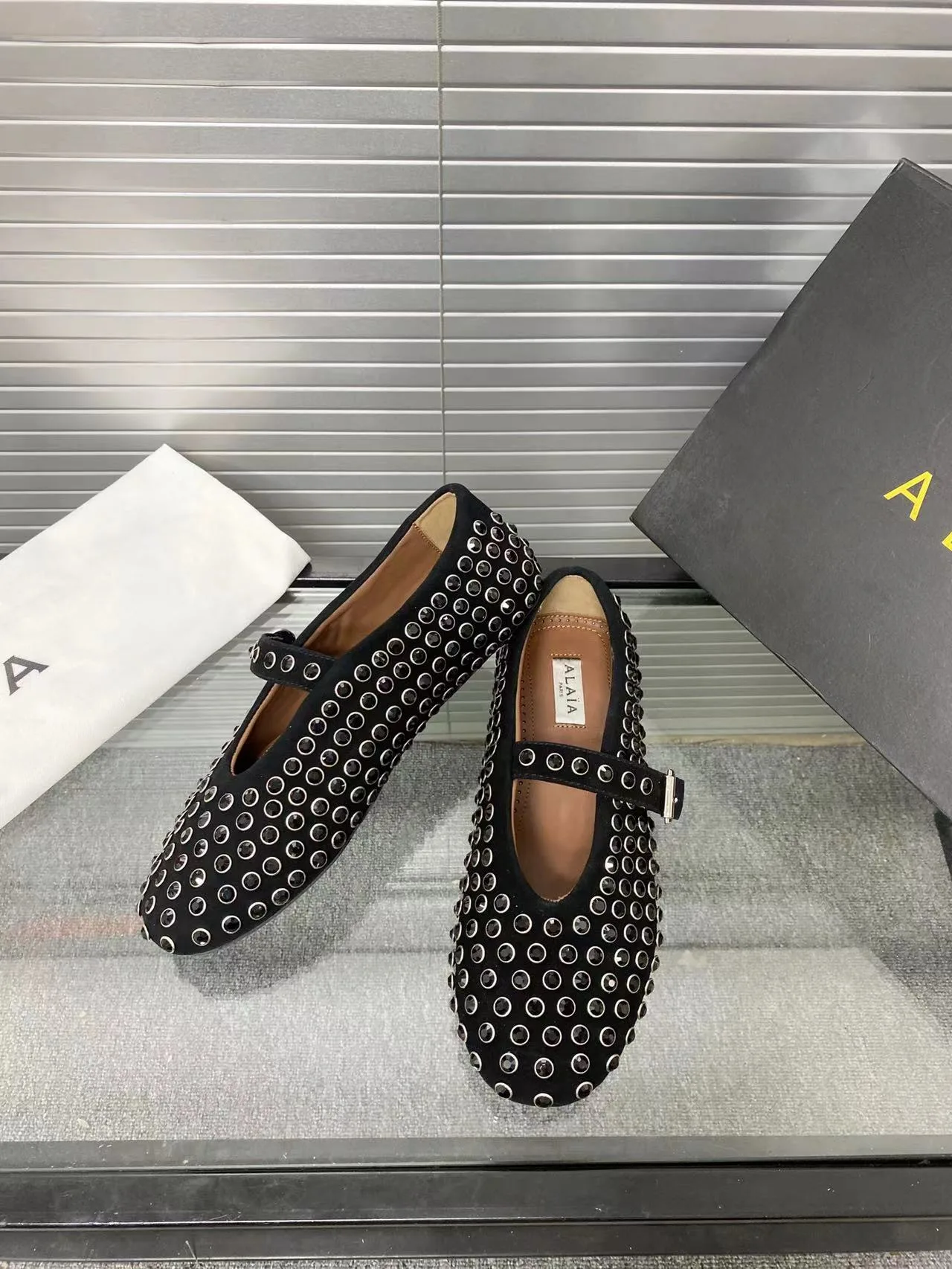 Alaia Cowhide Sheepskin Round-Toe Studded Mary Jane Flats in Black · view 4