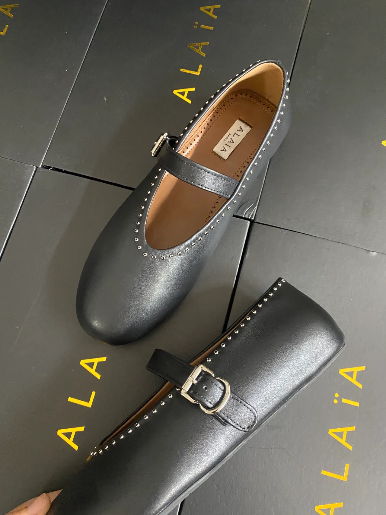 Alaia Cowhide Sheepskin Smooth Round-Toe Mary Jane Flats in Black · view 3