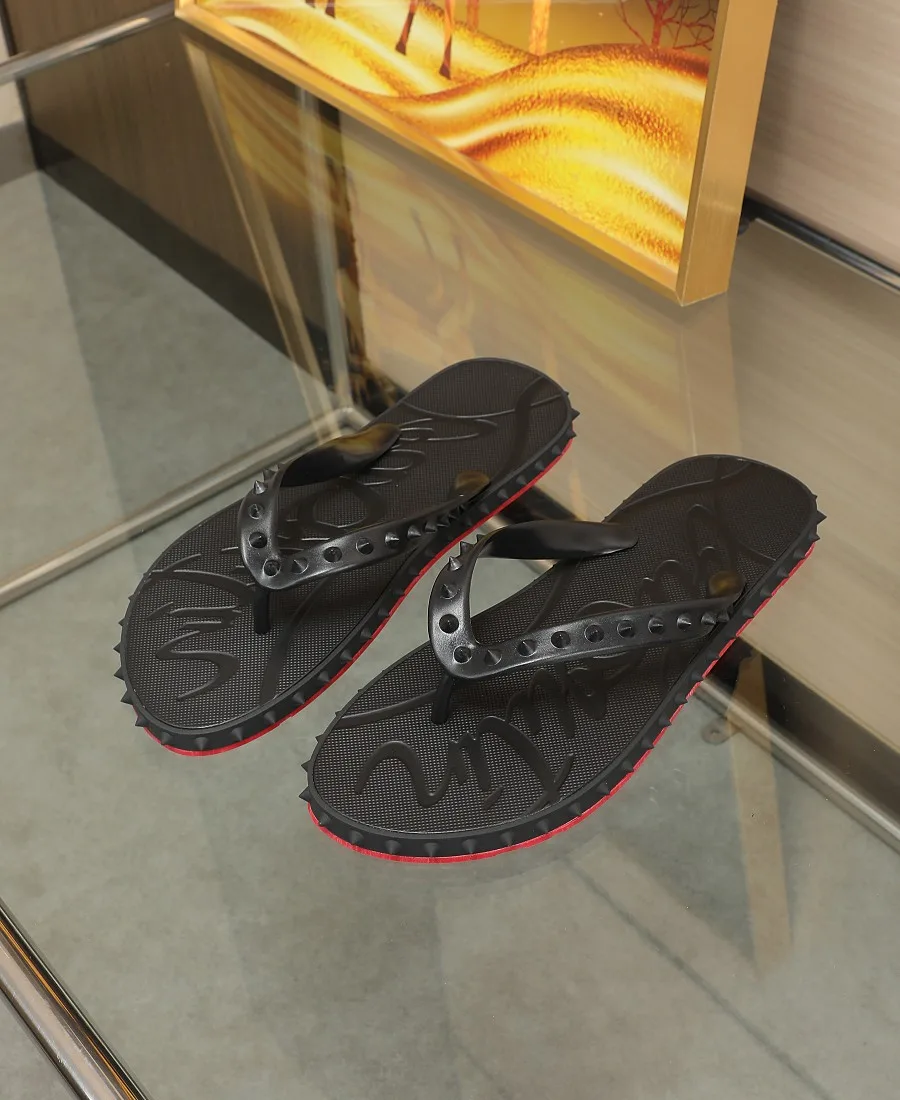 Christian Louboutin Studded Flip-Flops in Black · view 1