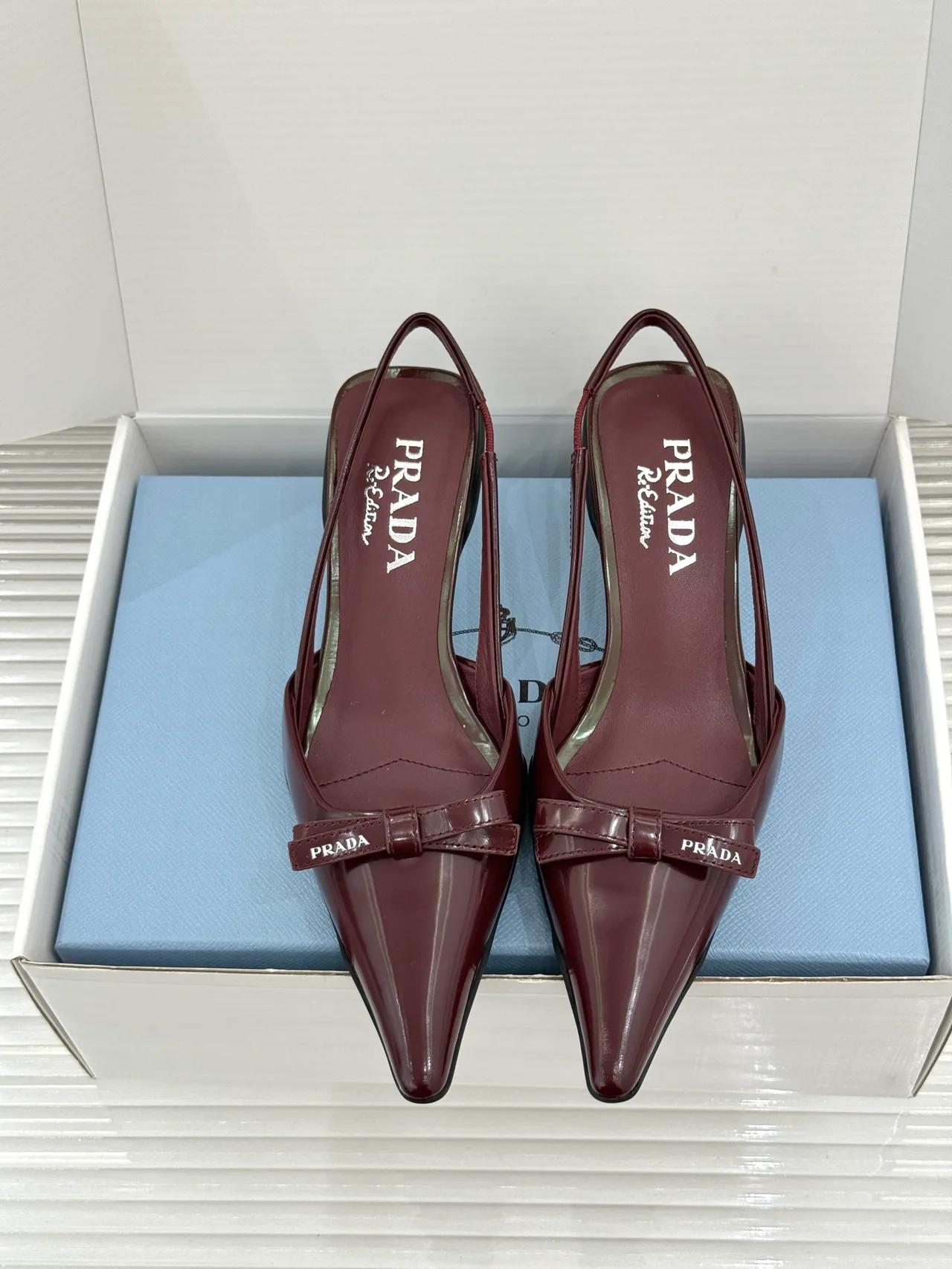 Prada Lambskin Pointed Slingback Pumps in Burgundy · view 1