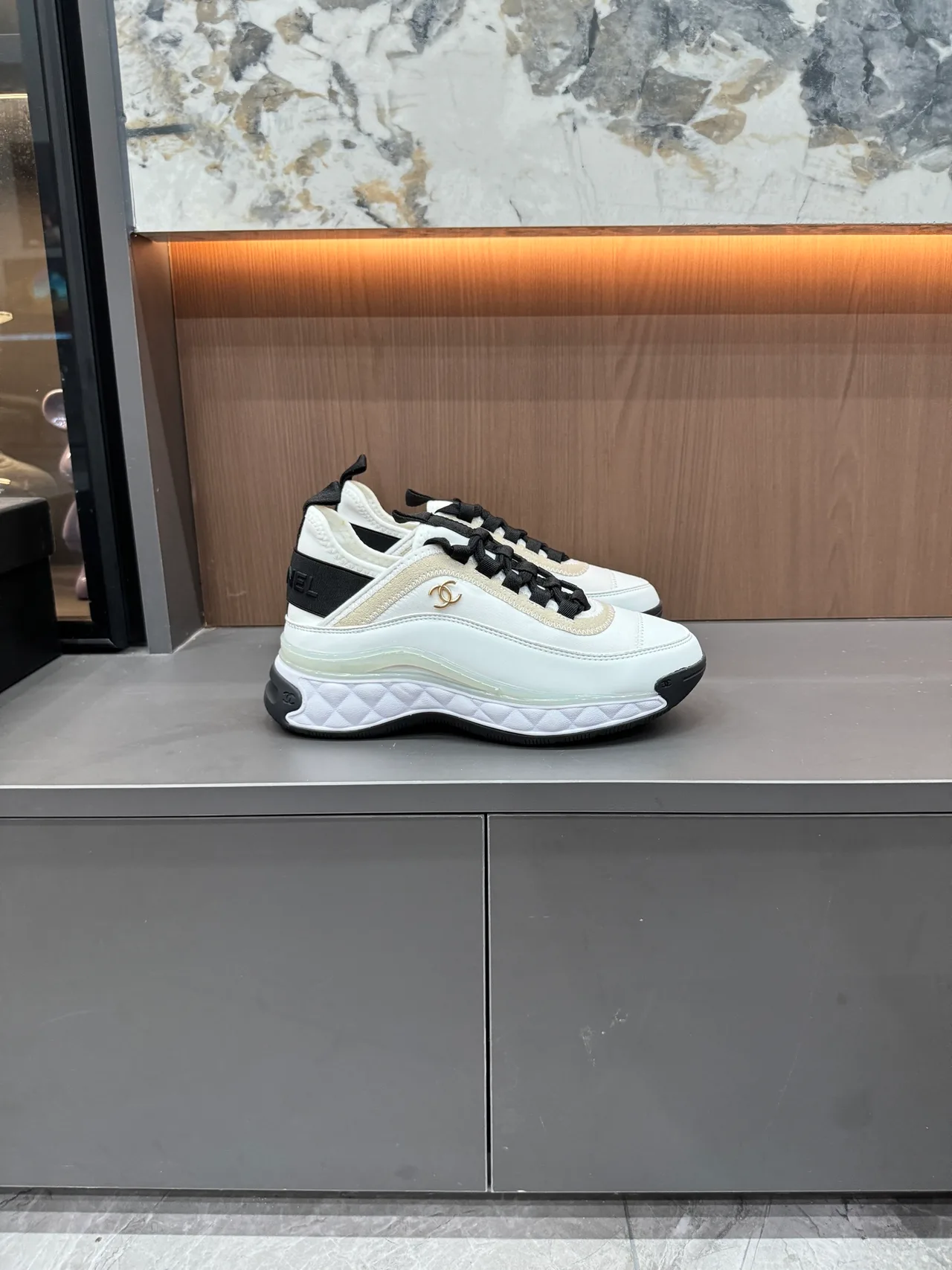 Chanel Cowhide Quilted Lace-Up Sneakers in White · view 4