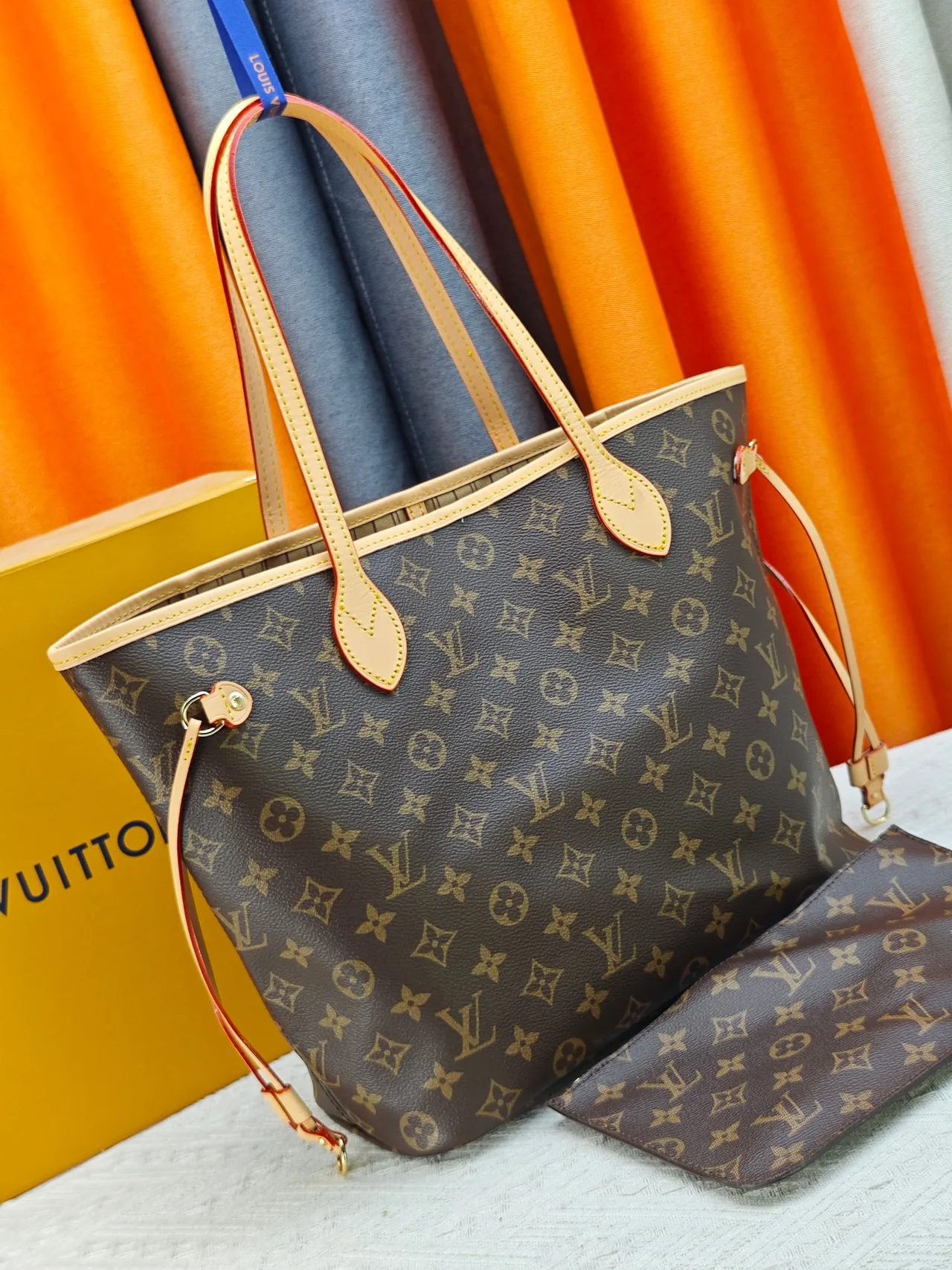 Louis Vuitton Neverfull Clutch in Brown · view 2
